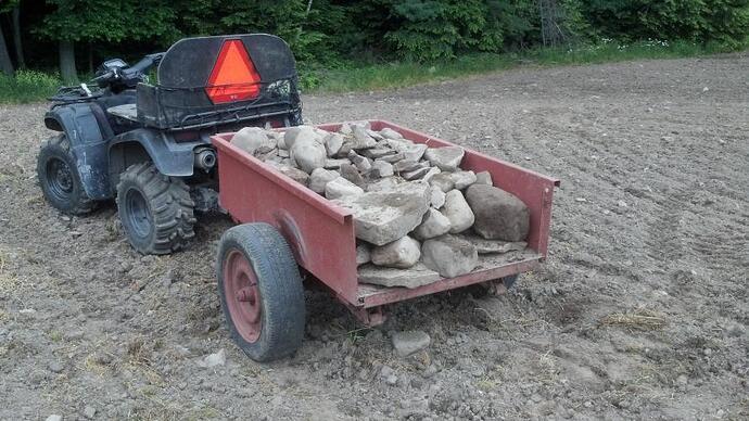 atv and small trailer rocks