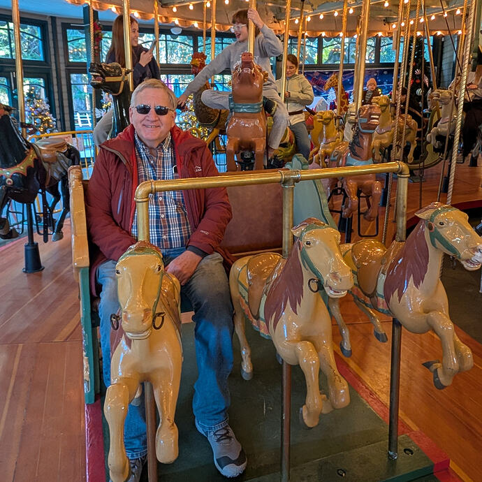 old guy on merry-go-round