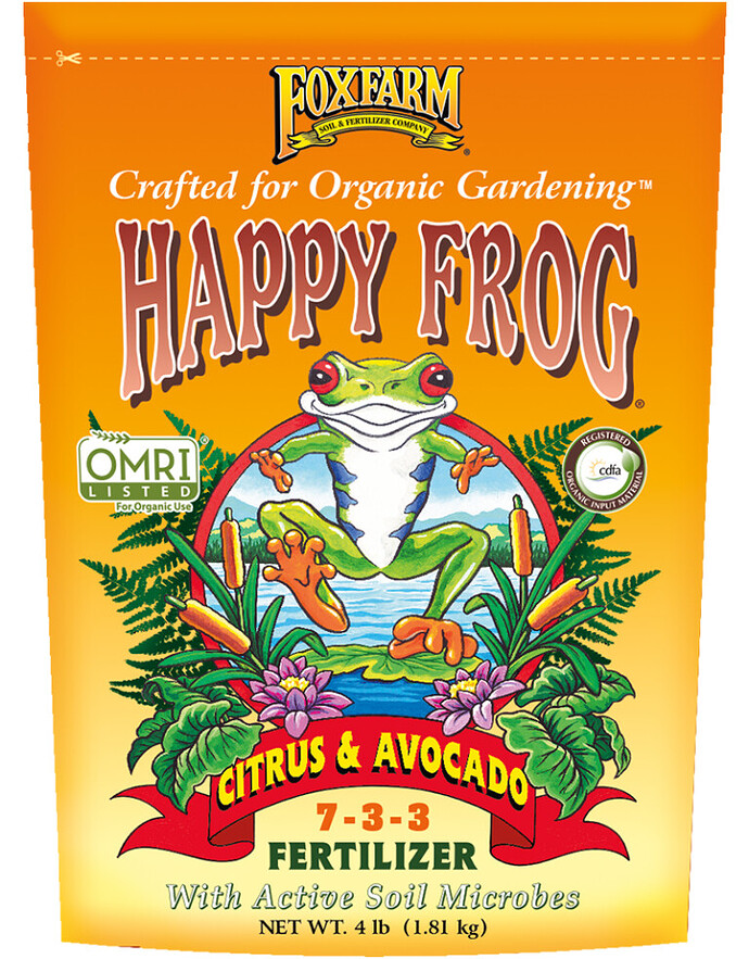 A fertilizer bag labeled "Happy Frog Citrus & Avocado 7-3-3" shows a cartoon frog among citrus fruits and flowers.